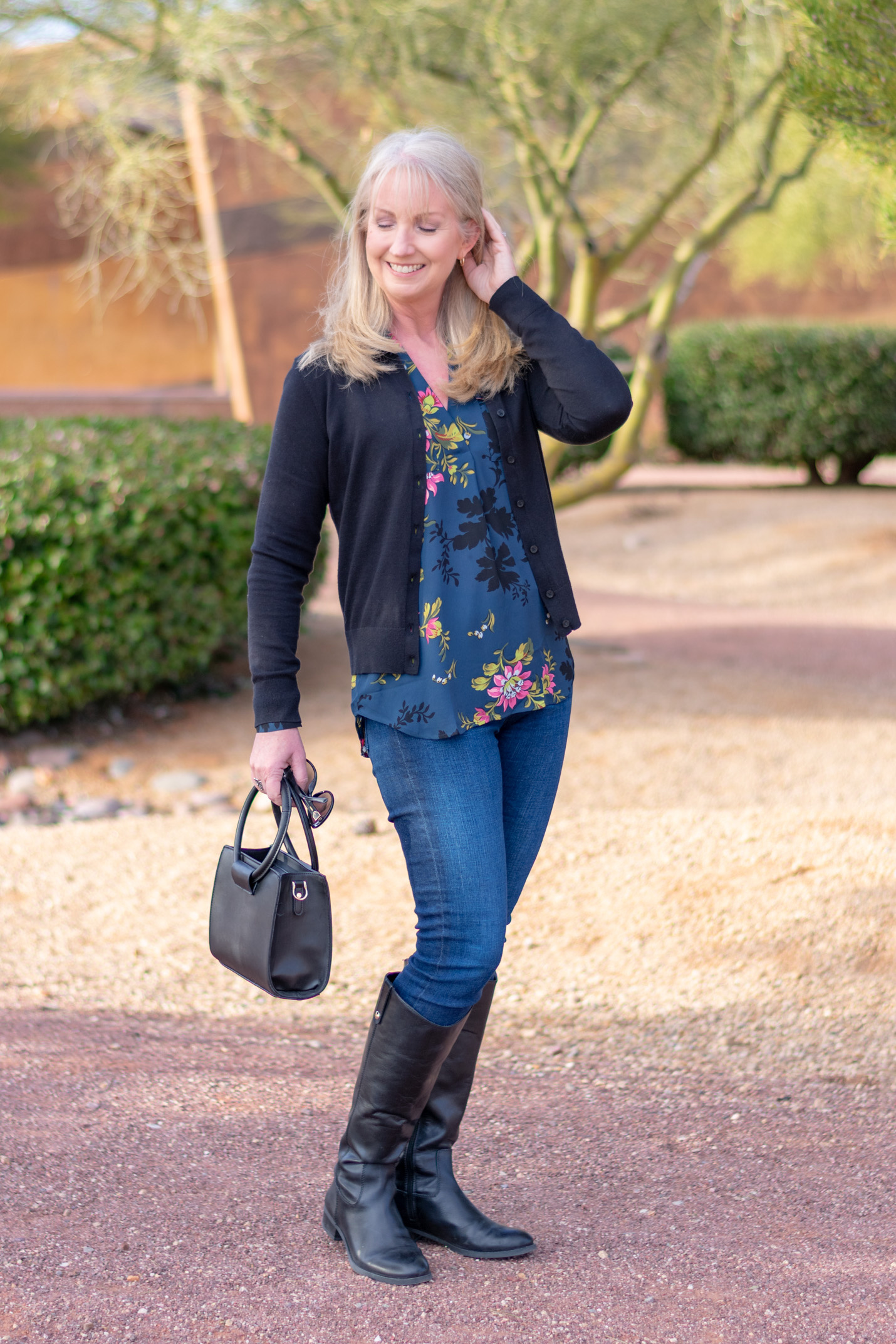 black riding boots with blue jeans