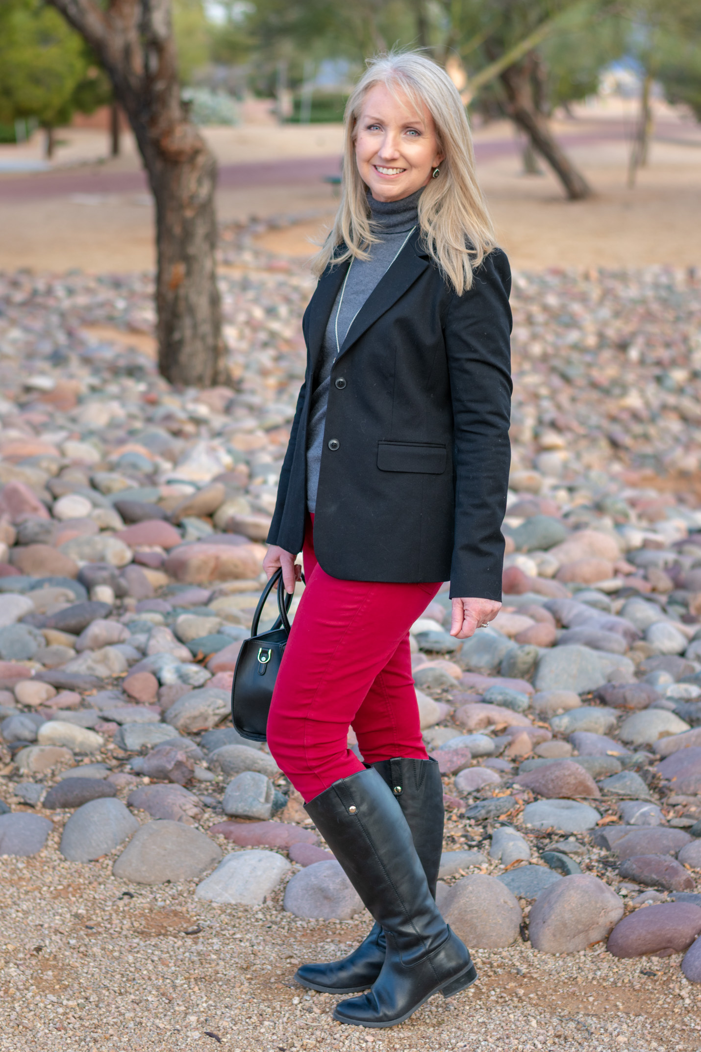 black riding boots with colored jeans
