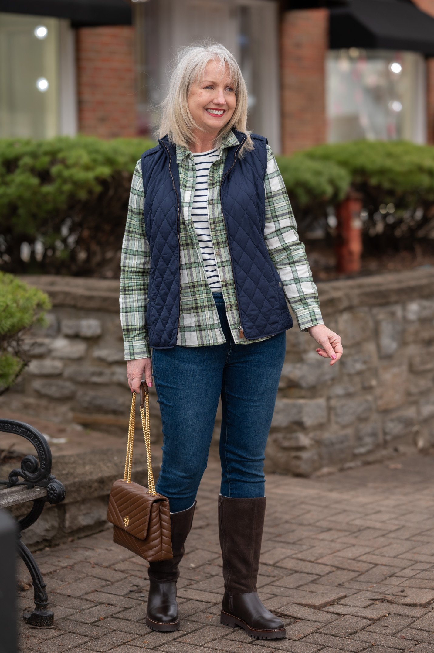 Flannel Shirt Layered with Striped Tee and Quilted Vest