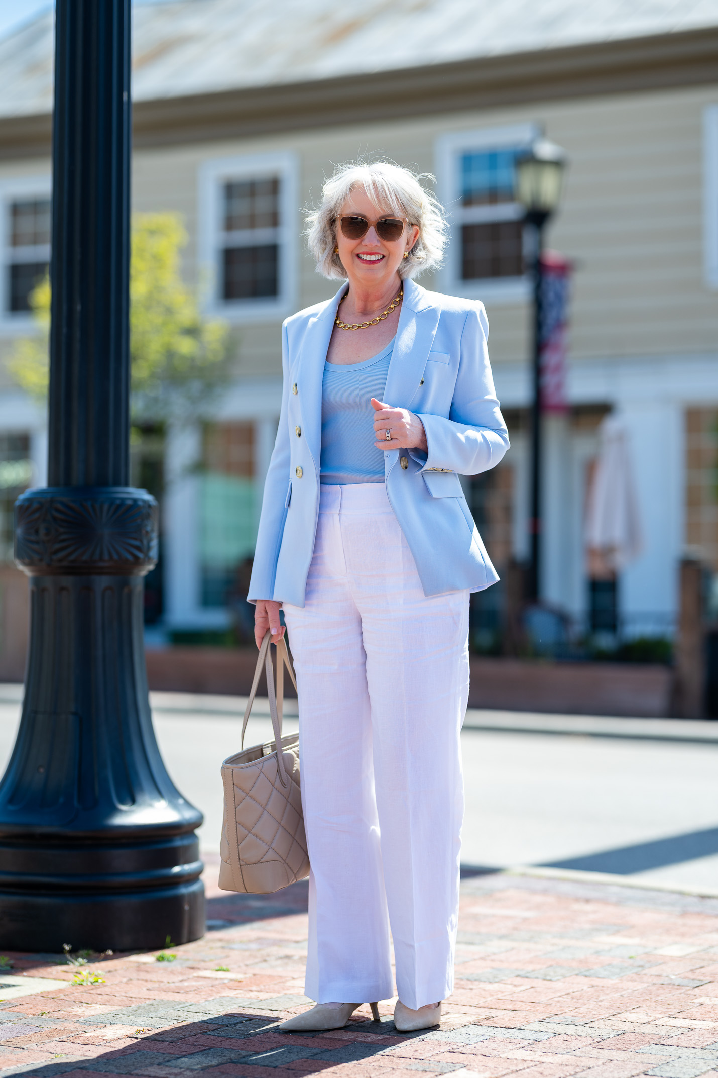 white linen pants with blue tank and jacket